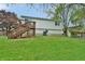 Spacious backyard features wooden deck, offering ample space for outdoor activities and relaxation at 4527 Peachwood Ct, Indianapolis, IN 46235