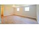 Large bedroom featuring two windows and dark wood floors at 4527 Peachwood Ct, Indianapolis, IN 46235