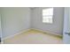 Cozy bedroom with neutral carpet and a window offering natural light at 4527 Peachwood Ct, Indianapolis, IN 46235