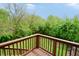 Deck showcasing the green space and blue sky, and is perfect for outdoor entertaining or relaxation at 4527 Peachwood Ct, Indianapolis, IN 46235