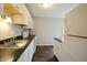 Bright kitchen showcasing white cabinetry, black countertops, and sleek stainless-steel appliances at 4527 Peachwood Ct, Indianapolis, IN 46235