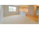 Inviting living room with neutral walls, plush carpet, and a staircase leading to the upper level at 4527 Peachwood Ct, Indianapolis, IN 46235