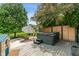 Backyard deck featuring a hot tub, seating, fire pit, and landscaping at 4601 Fairhope Dr, Indianapolis, IN 46237