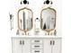 Elegant bathroom with double vanity, marble countertop, stylish mirrors, and modern fixtures offering comfort and luxury at 4601 Fairhope Dr, Indianapolis, IN 46237