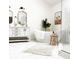 Modern bathroom with soaking tub, walk-in shower, double vanity, and elegant fixtures creating a serene oasis at 4601 Fairhope Dr, Indianapolis, IN 46237