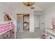 Bright bedroom featuring a bunk bed, closet, and playful decorative accents at 4601 Fairhope Dr, Indianapolis, IN 46237