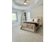 Bright bedroom features a large bed with plush bedding, soft carpet and natural light creating a cozy atmosphere at 4601 Fairhope Dr, Indianapolis, IN 46237