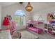 Charming bedroom with a bunk bed, large window, and playful decor at 4601 Fairhope Dr, Indianapolis, IN 46237