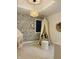 Whimsical bedroom design with unique wallpaper and a cozy reading nook at 4601 Fairhope Dr, Indianapolis, IN 46237
