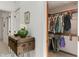 Walk-in closet with ample storage space and organized hanging racks at 4601 Fairhope Dr, Indianapolis, IN 46237