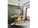 Elegant dining room with dark accent walls, stylish chandelier and a modern table set at 4601 Fairhope Dr, Indianapolis, IN 46237