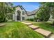 Stunning two-story home featuring a beautifully landscaped front yard and a charming, inviting entrance at 4601 Fairhope Dr, Indianapolis, IN 46237