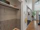 Hallway with tile accents, coat storage, and view of a bright, open entry at 4601 Fairhope Dr, Indianapolis, IN 46237