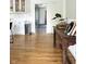Bright kitchen with white cabinets and hardwood floors leading to living area, creating a welcoming space at 4601 Fairhope Dr, Indianapolis, IN 46237