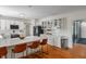 Spacious kitchen featuring a large island with seating, stainless steel appliances, and hardwood floors at 4601 Fairhope Dr, Indianapolis, IN 46237