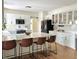 Well-lit kitchen with white cabinets, stainless steel appliances, and a spacious island at 4601 Fairhope Dr, Indianapolis, IN 46237