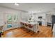 Open concept kitchen featuring a large island, modern appliances, and access to outdoor patio at 4601 Fairhope Dr, Indianapolis, IN 46237