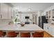 Bright and open kitchen featuring a center island with seating and modern appliances at 4601 Fairhope Dr, Indianapolis, IN 46237