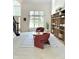 Spacious living room with natural light, cozy seating, and built-in bookshelves, ideal for Gathering time at 4601 Fairhope Dr, Indianapolis, IN 46237