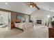 Spacious main bedroom with vaulted ceiling, fireplace, and ensuite bathroom at 4601 Fairhope Dr, Indianapolis, IN 46237