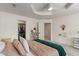 Comfortable bedroom features include a ceiling fan, walk-in closet, and a calming color palette at 4601 Fairhope Dr, Indianapolis, IN 46237