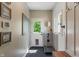 Functional mud room featuring stylish tile flooring, a dog wash station, and convenient hooks at 4601 Fairhope Dr, Indianapolis, IN 46237