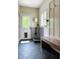 Convenient mud room with dog wash station and built-in bench creates a functional and stylish entryway at 4601 Fairhope Dr, Indianapolis, IN 46237