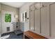 Bright mud room with a dog wash station, bench seating and wall hooks at 4601 Fairhope Dr, Indianapolis, IN 46237