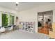 Well-lit playroom featuring a desk, shelving, and a view into the main living spaces of the house at 4601 Fairhope Dr, Indianapolis, IN 46237