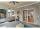 Bright sunroom with brick walls, casual seating and direct backyard access at 4601 Fairhope Dr, Indianapolis, IN 46237