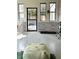 Bright sunroom featuring whitewashed brick, comfortable hammock, and tranquil views at 4601 Fairhope Dr, Indianapolis, IN 46237