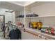 Walk-in closet with built-in shelving and hanging racks for optimal storage and organization at 4601 Fairhope Dr, Indianapolis, IN 46237