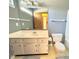 Bathroom featuring a light-colored vanity, a large mirror, and a standard toilet at 4947 Peony Pl, Indianapolis, IN 46254