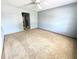 A carpeted bedroom with a ceiling fan at 4947 Peony Pl, Indianapolis, IN 46254