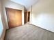 A bedroom featuring a large closet and neutral carpet at 4947 Peony Pl, Indianapolis, IN 46254