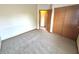 A carpeted bedroom with a closet at 4947 Peony Pl, Indianapolis, IN 46254