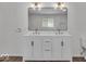 Bathroom featuring double sinks, quartz countertop, and modern fixtures at 4956 W 11Th St, Speedway, IN 46224