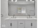 Bathroom showcasing double sink vanity, quartz countertop, and contemporary mirrors at 4956 W 11Th St, Speedway, IN 46224