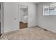 Simple bedroom with carpet flooring, natural lighting, and closet view to bath at 4956 W 11Th St, Speedway, IN 46224