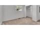 Neutral bedroom features plush carpeting, natural light, and a closet at 4956 W 11Th St, Speedway, IN 46224