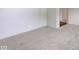 A bedroom featuring neutral carpeting and white walls at 4956 W 11Th St, Speedway, IN 46224