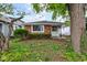 Charming single-story home featuring a brick facade and a well-maintained front yard at 4956 W 11Th St, Speedway, IN 46224
