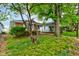 Charming single-story home featuring a brick facade and a well-maintained front yard at 4956 W 11Th St, Speedway, IN 46224