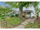 Charming single-story home featuring a brick facade and a well-maintained front yard at 4956 W 11Th St, Speedway, IN 46224