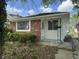 Charming single-story home featuring a brick facade and a well-maintained front yard at 4956 W 11Th St, Speedway, IN 46224