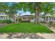 Charming brick home featuring a well-maintained lawn and mature trees in a quiet neighborhood at 4956 W 11Th St, Speedway, IN 46224
