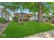 Charming brick home featuring a well-maintained lawn and mature trees in a quiet neighborhood at 4956 W 11Th St, Speedway, IN 46224