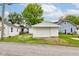 White detached garage with a single car door and white trim at 4956 W 11Th St, Speedway, IN 46224