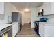 Modern kitchen featuring new stainless appliances, countertops, and ample cabinet space at 4956 W 11Th St, Speedway, IN 46224