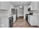 Modern kitchen features stainless steel appliances, white cabinets, and sleek countertops at 4956 W 11Th St, Speedway, IN 46224